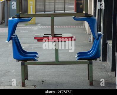 Two outdoor tables and seats seen during the covid-19 pandemic. Stock Photo