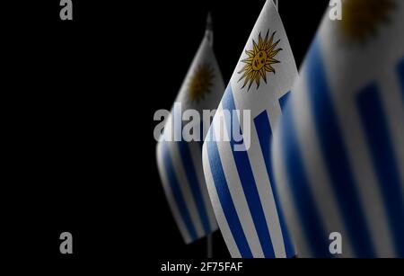 Small national flags of the Uruguay on a black background Stock Photo