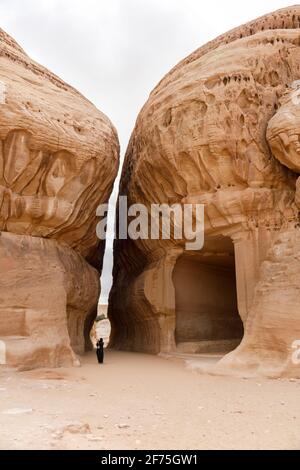 Al Ula, Saudi Arabia, February 19 2020: Tourist inside the Siq of Jabal Ithlib in Al Ula, KSA Stock Photo