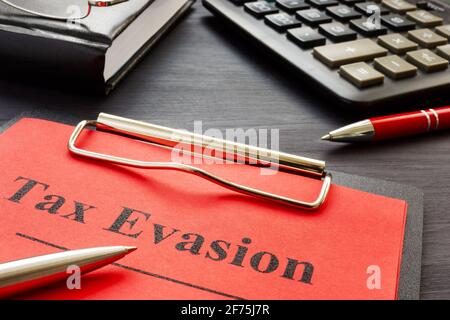 Tax evasion result of audit with clipboard. Stock Photo