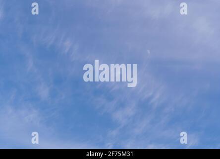 Abstract template with blue sky, white clouds and waxing half moon. Beauty of nature concept. Abstract natural background. Stock Photo