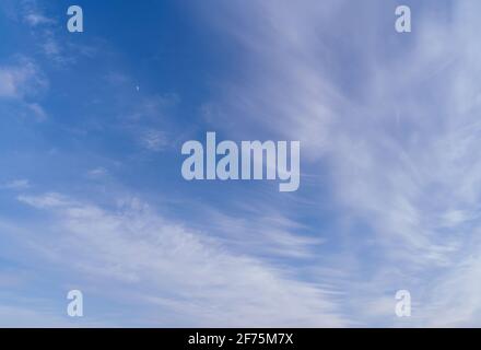 Abstract template with blue sky, white clouds and waxing half moon. Beauty of nature concept. Abstract natural background. Stock Photo
