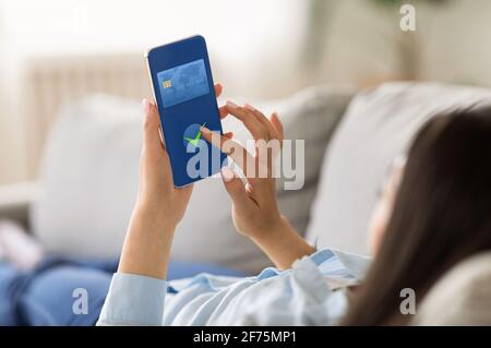 Unrecognizable Woman Using Smartphone With Payment Screen At Home Stock Photo