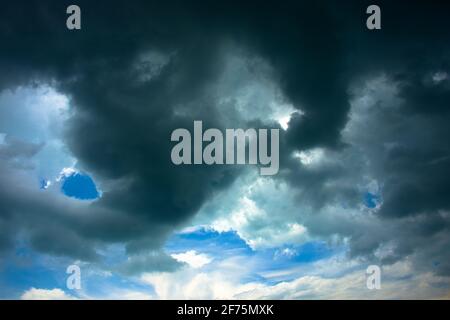 Dramatic monsoon storm clouds gathering over the South China Sea off the South coast of Singapore Stock Photo