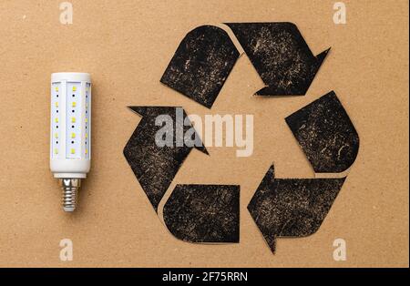LED light bulb with recycle symbol on craft paper Stock Photo