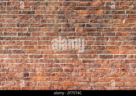 Brick wall background variety of bricks brick wall showing signs of weathering and wear, hand made bricks with lime mortar High resolution Stock Photo