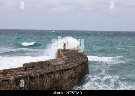 Portreath,Cornwall, 5th April 2021,Yesterday people were out enjoying the glorious sunshine on the beach, what a difference a day makes, as today its grey and chilly with a deserted beach in Portreath,Cornwall. The high forecast for today is 8C with a fresh breeze.Credit: Keith Larby/Alamy Live News Stock Photo