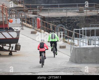 Portreath,Cornwall, 5th April 2021,Yesterday people were out enjoying the glorious sunshine on the beach, what a difference a day makes, as today its grey and chilly  in Portreath,Cornwall. The high forecast for today is 8C with a fresh breeze.Credit: Keith Larby/Alamy Live News Stock Photo