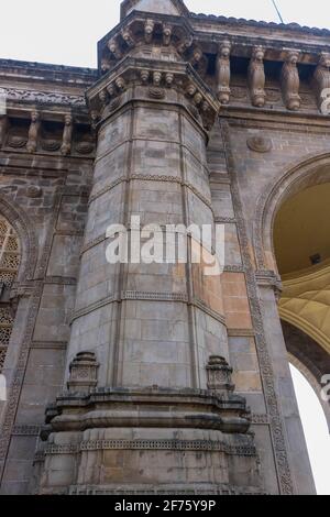 A closeup shot of the intricate architecture of the 'Gateway of India' built in the early twentieth century in the city of Mumbai, in the Indian state Stock Photo