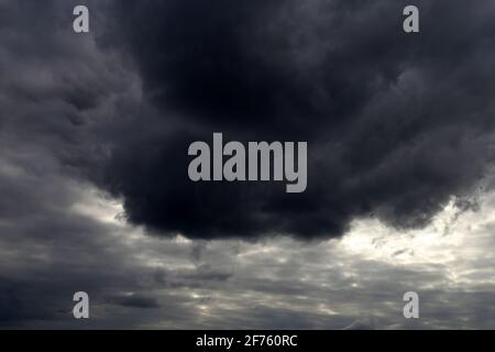 Sky covered with dark storm clouds. Dramatic background for weather before rain Stock Photo