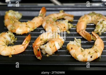 Shrimps are grilled with spices. Cooking prawns, delicious dish Stock Photo