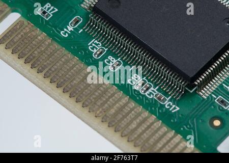 printed green circuit board with plug-in contacts chip Stock Photo