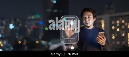 Banner of Asian creative freelancer using smart mobile phone with authentificate by fingerprint in the financial district area at bangkok river side, Stock Photo