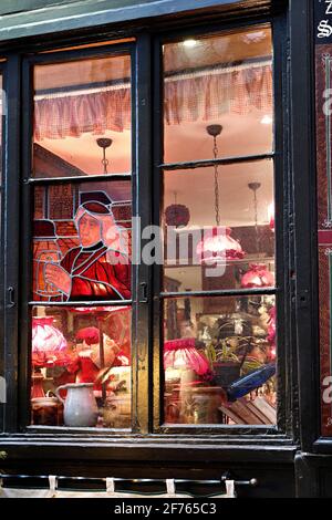 France, Alsace, Bas-Rhin, Strasbourg, Christmas market, a stained glass window seen from the street. Stock Photo