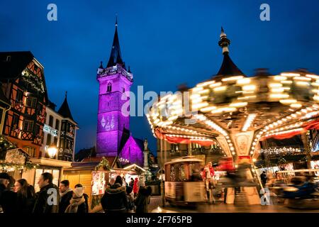 France, Alsace, Bas-Rhin, Obernai, Christmas market and carousel. Stock Photo
