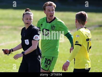 Referee Rebecca Welch (left) speaks with Port Vale's Tom Conlon and Harrogate Town's Lloyd Kerry (right) during the Sky Bet League Two match at the EnviroVent Stadium, Harrogate. Picture date: Monday April 5, 2021. Stock Photo