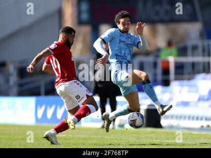 Coventry City's Sam McCallum (right) and Bristol City's Adrian Mariappa battle for the ball during the Sky Bet Championship match at St. Andrew's Trillion Trophy Stadium, Birmingham. Picture date: Monday April 5, 2021. Stock Photo