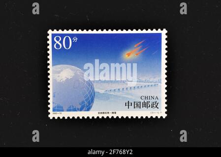 CHINA - CIRCA 2003: A stamps printed in China shows The Meteorite Shower over Jilin,  circa 2003. Stock Photo