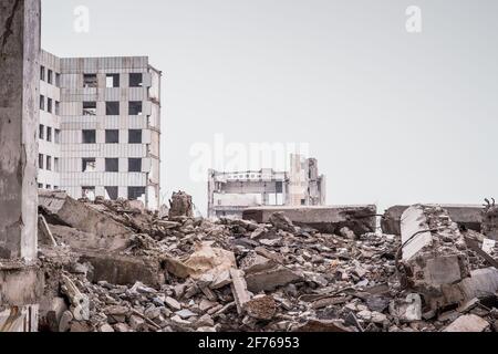 Concrete wreckage closeup of a destroyed building isolated on a white ...
