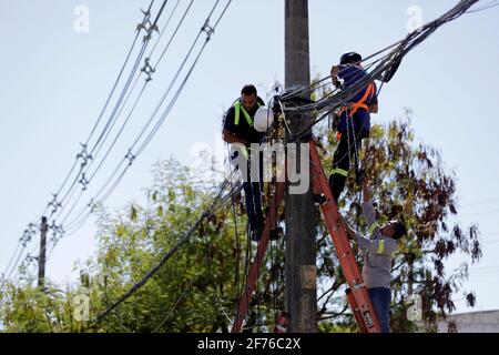 salvador, bahia / brazil - march 12, 2019: Workers are seen making repairs to the electric network in the city of Salvador. *** Local Caption *** Stock Photo