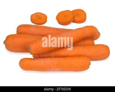 Washed carrots and carrot slices isolated on white background Stock Photo