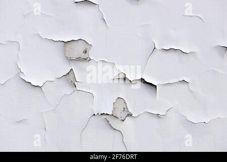 concrete wall with white cracked paint. High quality photo Stock Photo