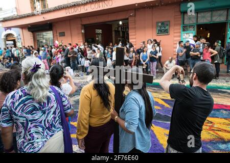 Intricate and vibrant sawdust alfombras decorate the cobblestone streets of Antigua, Guatemala in preparation for the Semana Santa processions. Stock Photo