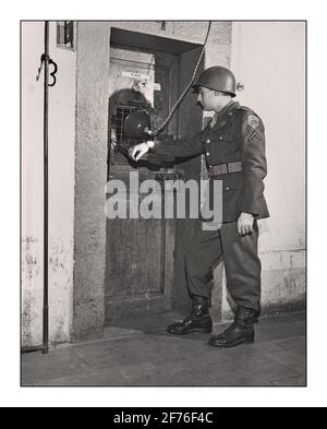 NUREMBERG RUDOLF HESS PRISON CELL American Army Soldier stands permanent guard outside the Nuremberg prison cell of  leading Nazi Rudolf Hess German WW2 War Crimes Trial 1945 Stock Photo