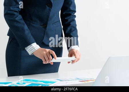 Businesswoman doing photo of document Stock Photo