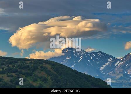 Lenticular cloud formation over volcano Stock Photo