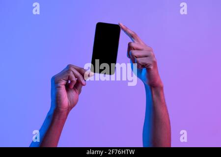 Two African American Male Hands Holding Smartphone With Black Screen, Mockup Image Stock Photo