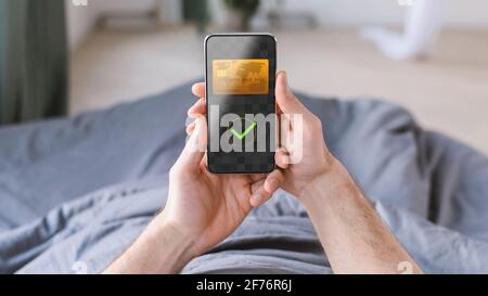 Unrecognizable Man Using Smartphone Payment Screen At Home Stock Photo