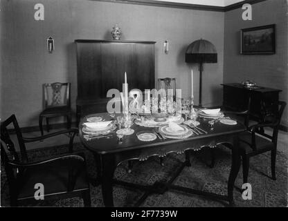 Building and Bo Exhibition in Östersund in 1929. Tableclothed table in dining room. Stock Photo