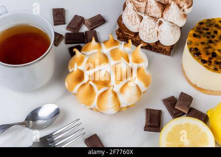 Mini chocolate, lemon pie and passion fruit cake. Stock Photo