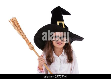 Child with halloween hat and a witch broom Stock Photo