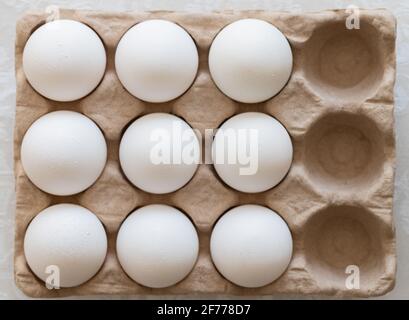 Carton of Eggs with Three Missing Stock Photo