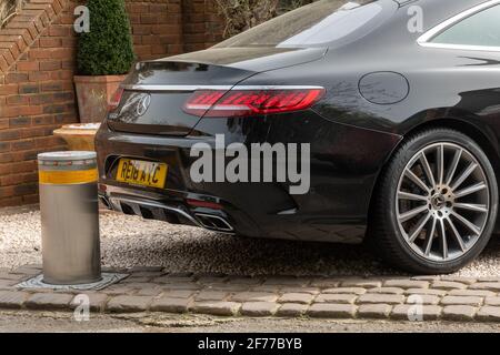 Rising bollard as an anti-theft device in a private driveway to prevent car theft, UK Stock Photo