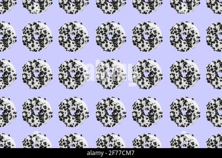 Pattern made with black and white cookie donut on blue background Stock Photo