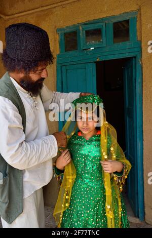 Iran, Fars province, Pasargad Sadat, Little girl getting dressed for a wedding Stock Photo
