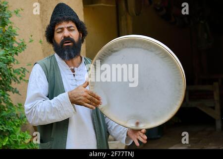Iran, Fars province, Pasargad Sadat, Man singing and playing daf Stock Photo