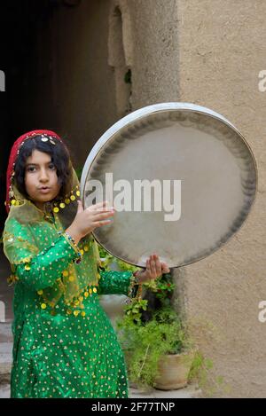 Iran, Fars province, Pasargad Sadat, Little girl playing daf Stock Photo