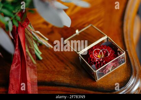 Wedding rings in a beautiful glass box on the table Stock Photo