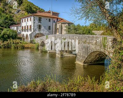 The medieval bridge over Rio Ulzama and the albergue at La Trinidad de Arre, Spain, October 15, 2009 Stock Photo