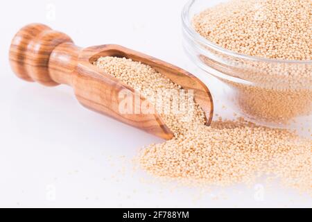 Organic amaranth seeds in wooden spoon - Amaranthus Stock Photo