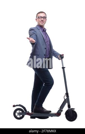 Pleasant smiling man riding a kick scooter Stock Photo