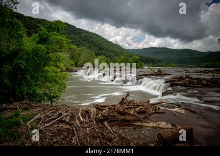 Moody skies over Sandstone Falls within the New River Gorge National Park in West Virginia during a late Spring afternoon. Stock Photo