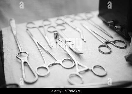 Old medical and surgical instruments. German Deutsch Wehrmacht World War II Times Many Old surgical instruments For surgery. WWII WW2. Black And White Stock Photo