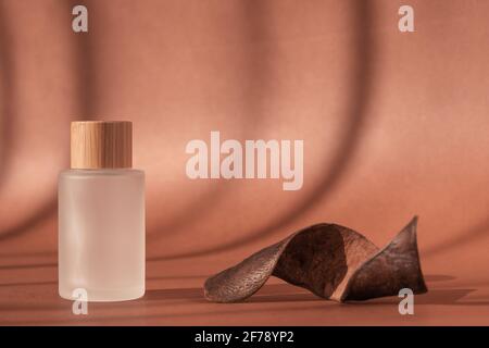 Product presentation, cosmetics brand, lotion, peptide, collagen, hyaluronic acid in glass bottle, wooden decor. Cream beauty skincare cosmetic mockup Stock Photo