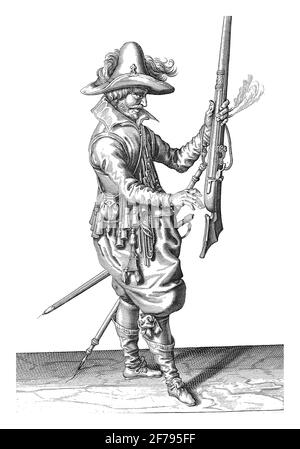 A Soldier, Full Length, to the Right , who is holding a musket (a certain type of firearm), vintage engraving. Stock Photo