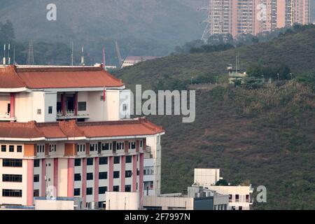 Luohu area of Shenzhen City, (left) with Nam Hang Police Post (on hillside, right), New Territories, Hong Kong/Shenzhen Border Area China, March 2021 Stock Photo